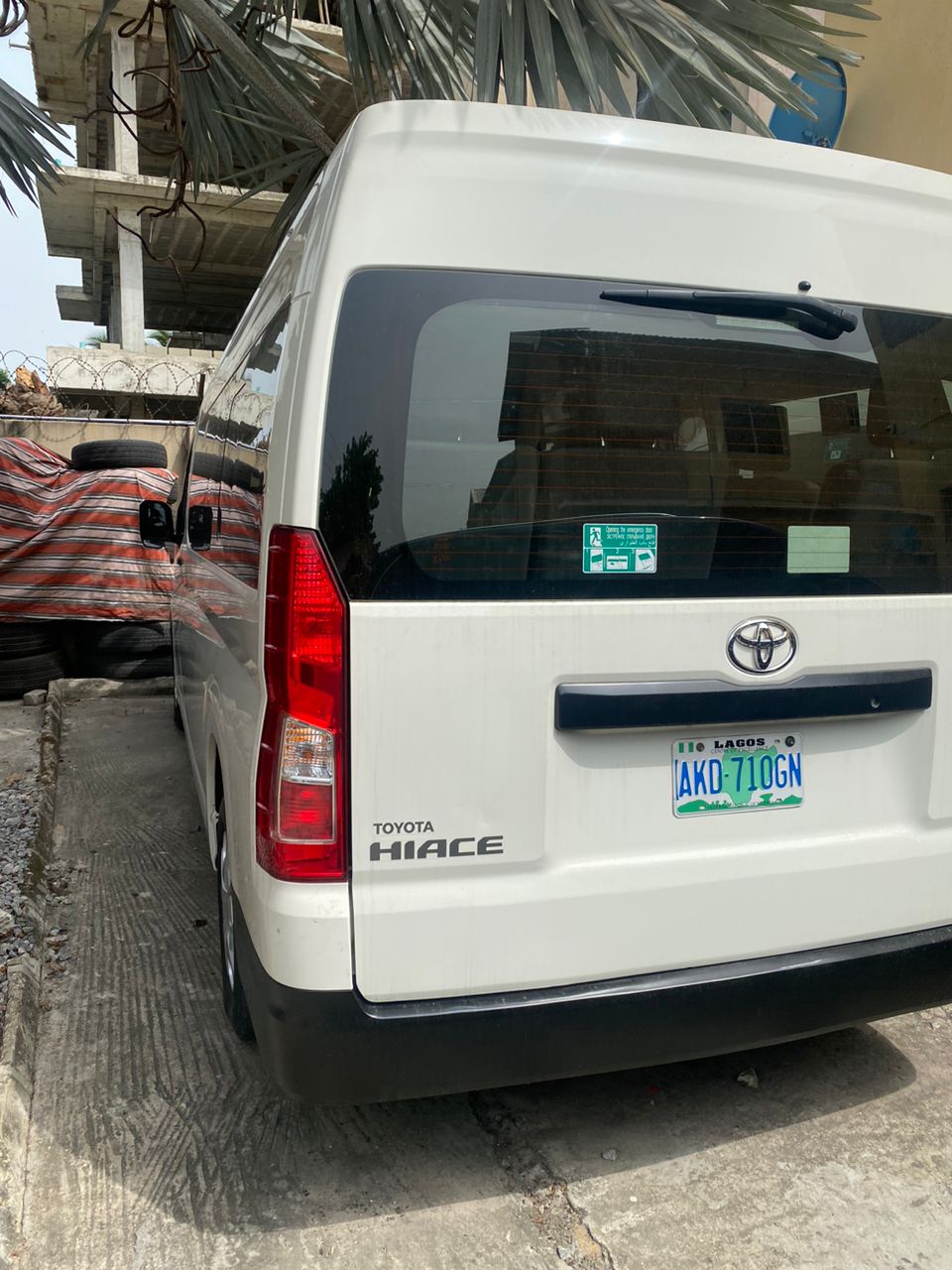 Rear view of a white Toyota Hiace showing the Hiace badge and Lagos number plate