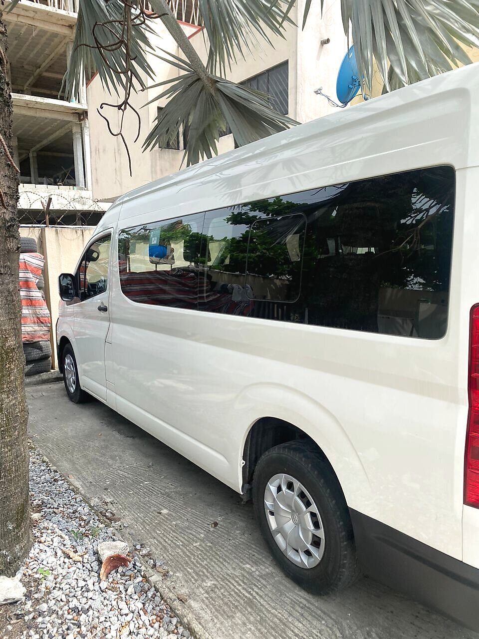 Hiace bus for group trips and events around Opebi and Allen Avenue, Ikeja - close side view